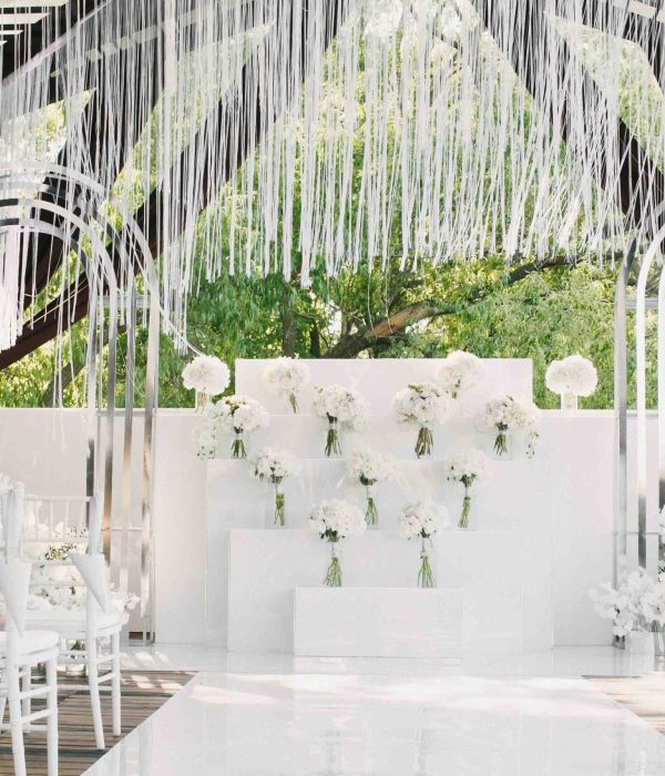 classy white wedding decorated with beautiful flowers